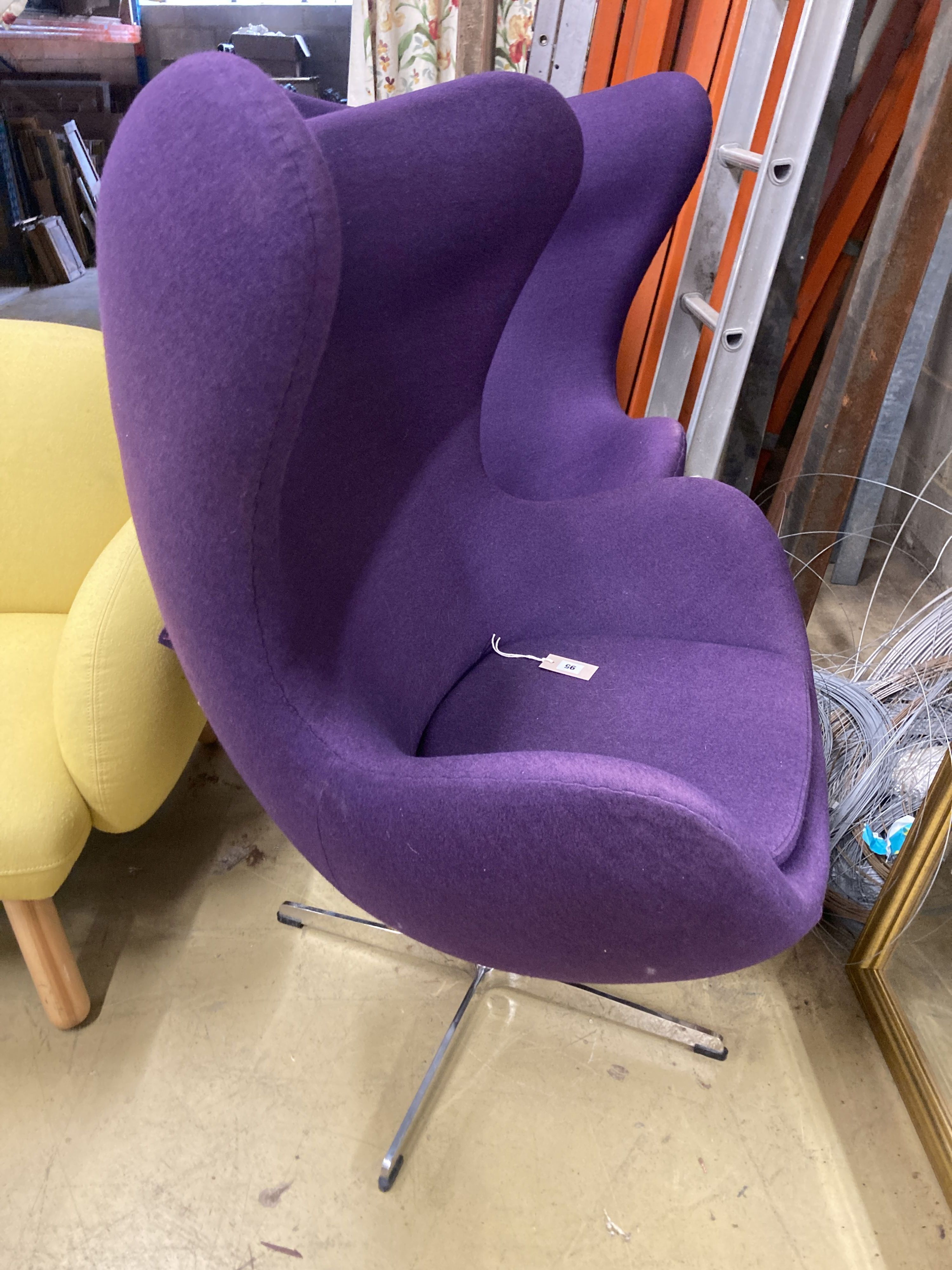 A pair of contemporary purple fabric egg chairs, width 85cm, depth 75cm, height 112cm